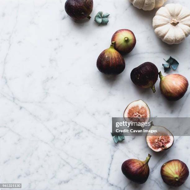 overhead view of figs and pumpkins on table - dry fruits stock pictures, royalty-free photos & images