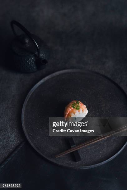 high angle view of sushi with chopsticks in plate - 皿　和 ストックフォトと画像