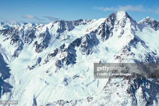 scenic view of snowcapped mountain on sunny day - val senales imagens e fotografias de stock