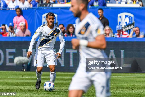 Los Angeles Galaxy midfielder Jonathan dos Santos runs in control of the ball during the LA Galaxy versus the Montreal Impact game on May 21 at Stade...