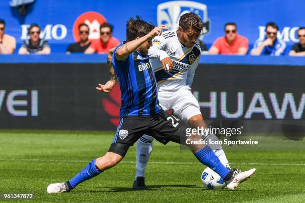 Montreal Impact defender Michael Petrasso battles with Los Angeles Galaxy midfielder Perry Kitchen for the ball during the LA Galaxy versus the...
