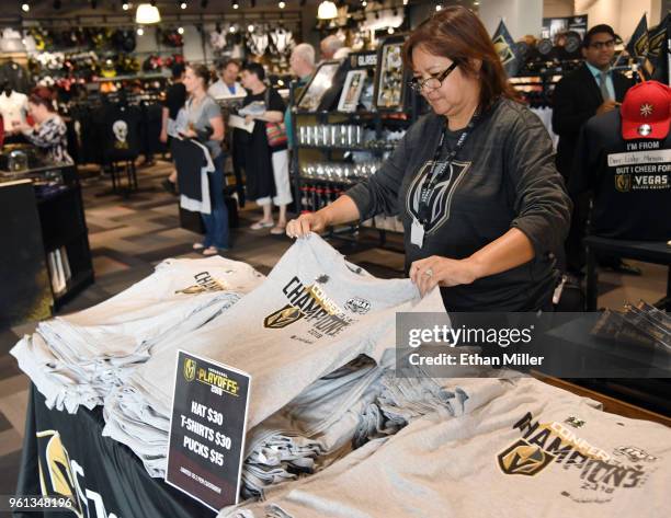 Vegas Golden Knights "Western Conference Champions" T-shirts are displayed at the Arsenal retail store at City National Arena the day after the team...