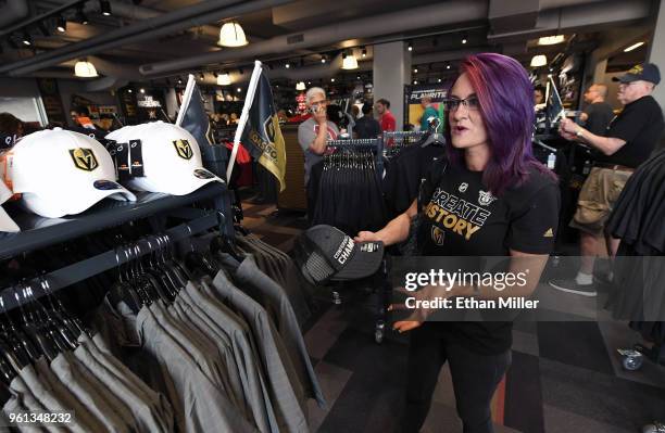 Vegas Golden Knights fan Mishon Randall of Nevada shops for Golden Knights gear at the Arsenal retail store at City National Arena the day after the...