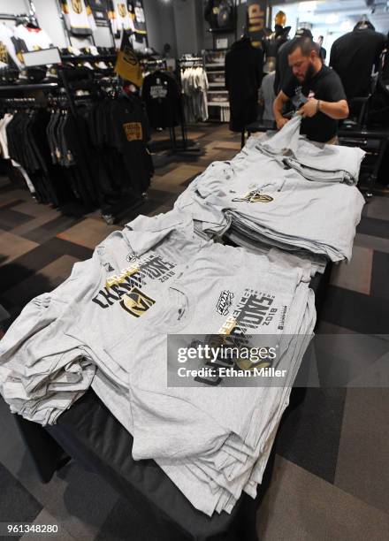 Patron looks at Vegas Golden Knights "Western Conference Champions" T-shirts at the Arsenal retail store at City National Arena the day after the...