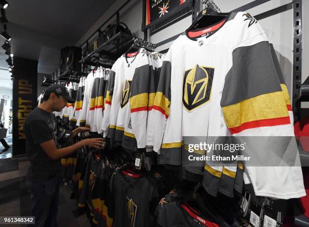 Vegas Golden Knights jerseys are displayed at the Arsenal retail store at City National Arena the day after the team won the Western Conference...