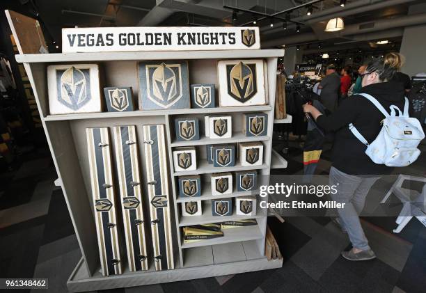 Customers shop for Vegas Golden Knights gear at the Arsenal retail store at City National Arena the day after the team won the Western Conference...