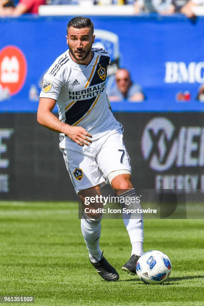 Los Angeles Galaxy midfielder Romain Alessandrini runs with the ball during the LA Galaxy versus the Montreal Impact game on May 21 at Stade Saputo...