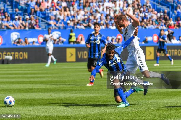 Los Angeles Galaxy midfielder Perry Kitchen pushes Montreal Impact midfielder Raheem Edwards on the ground during the LA Galaxy versus the Montreal...