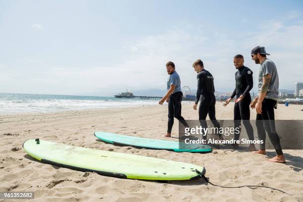 Jeremy Toljan and Maximilian Philipp of Borussia Dortmund are getting a surf lesson at the Venice Beach during Borussia Dortmund's USA Training Camp...