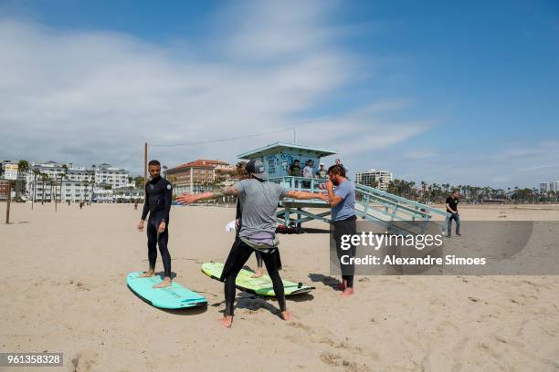 Jeremy Toljan and Maximilian Philipp of Borussia Dortmund are getting a surf lesson at the Venice Beach during Borussia Dortmund's USA Training Camp...