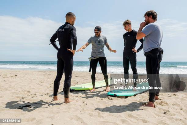 Jeremy Toljan and Maximilian Philipp of Borussia Dortmund are getting a surf lesson at the Venice Beach during Borussia Dortmund's USA Training Camp...