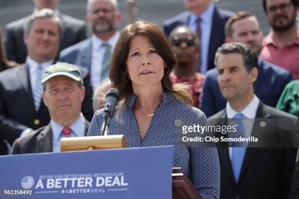 Rep. Cheri Bustos joins a group of fellow Democrats and their supporters to introduce a new campaign to retake Congress during a news conference at...
