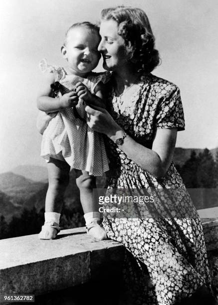 Eva Braun, companion of Adolf Hitler, Führer of the German Reich, poses with Gitta Schneider, daughter of her best friend Herta Schneider, in the...