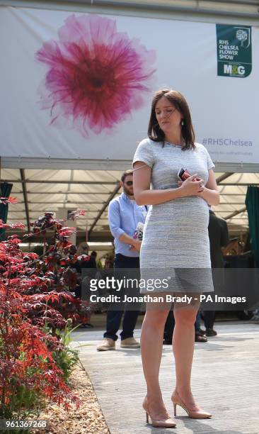 Visitors observe a moment's silence in remembrance of the victims of the 2017 Manchester bombing attack at the RHS Chelsea Flower Show at the Royal...