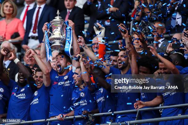Gary Cahill of Chelsea lifts the FA Cup trophy with his team mates during The Emirates FA Cup Final between Chelsea and Manchester United at Wembley...