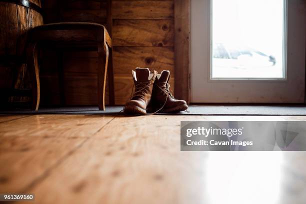 surface level image of leather boots on floor at home - leather boot 個照片及圖片檔