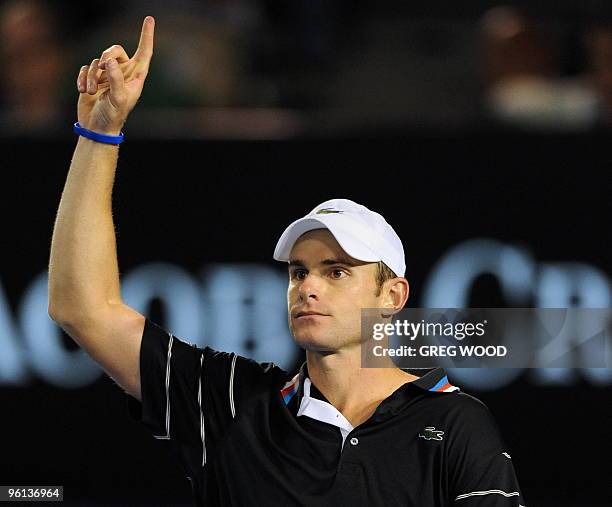 Andy Roddick of the US gestures to the video replay screen to question a call while playing against Fernando Gonzalez of Chile in their men's singles...