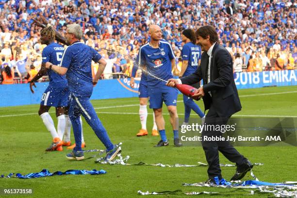 Antonio Conte head coach / manager of Chelsea sprays champagne during The Emirates FA Cup Final between Chelsea and Manchester United at Wembley...