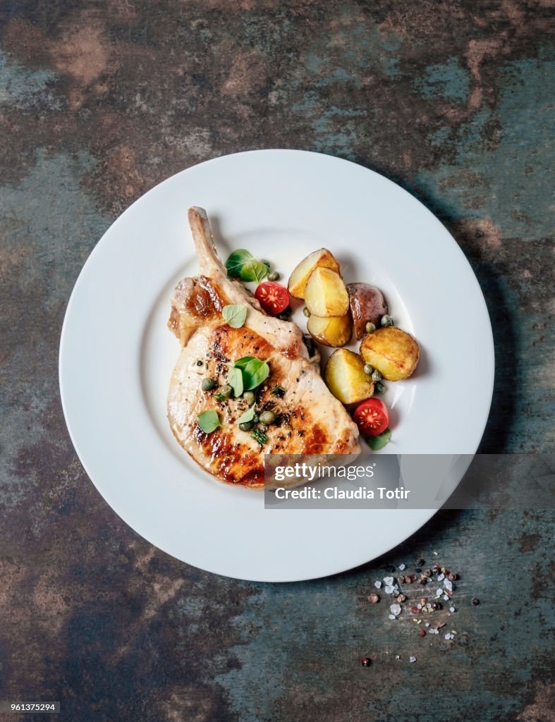 Roasted pork chop with potatoes