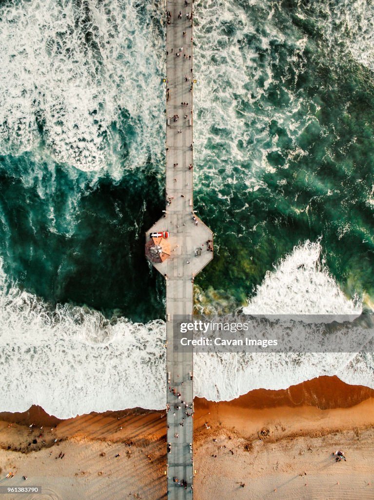 Overhead view of people on pier at Huntington Beach