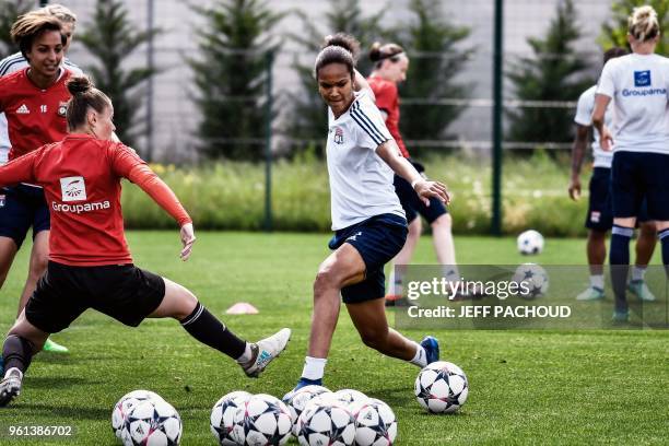 Olympique Lyonnais French player Wendie Renard and teammates take part in a training session, on May 22, 2018 in Lyon, few days before the Women's...