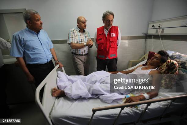 Francesco Rocca , the President of the International Federation of Red Cross and Red Crescent Societies, meets a Palestinian, receiving treatment for...