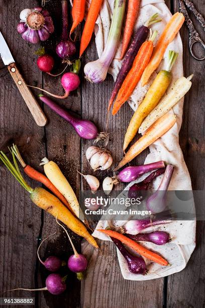 high angle view of various vegetables on wooden table - turnip stock pictures, royalty-free photos & images