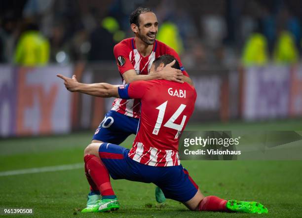 Juanfran of Club Atletico de Madrid celebrates with goalscorer Gabi during the UEFA Europa League Final between Olympique de Marseille and Club...