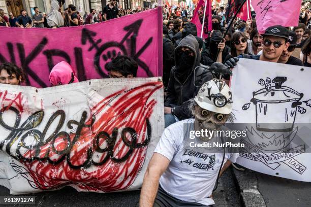 Protesters take part in a demonstration on May 22 in Lyon, central-eastern France, as part of a nationwide day of striking by French public sector...