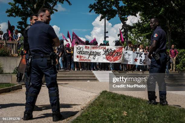 Protesters take part in a demonstration on May 22 in Lyon, central-eastern France, as part of a nationwide day of striking by French public sector...