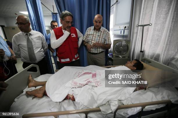 Francesco Rocca , the President of the International Federation of Red Cross and Red Crescent Societies, meets a Palestinian, receiving treatment for...