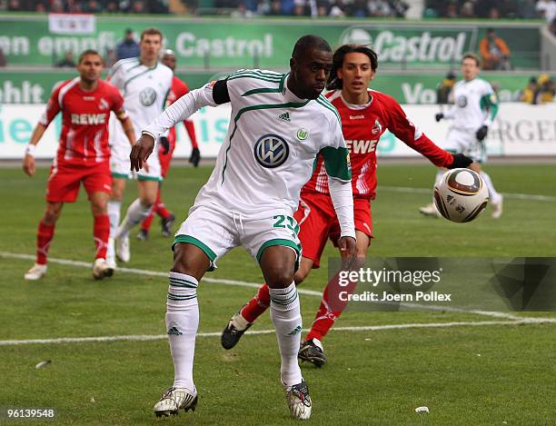 Grafite of Wolfsburg and Pedro Geromel of Koeln compete for the ball during the Bundesliga match between VfL Wolfsburg and 1. FC Koeln at Volkswagen...