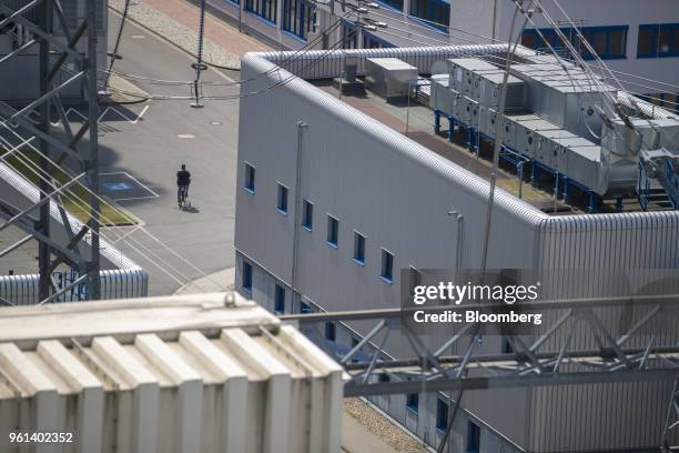 An employee cycles between buildings at the coal powered power plant operated by RWE AG in Lingen, Germany, on Tuesday, May 22, 2018. RWE is...