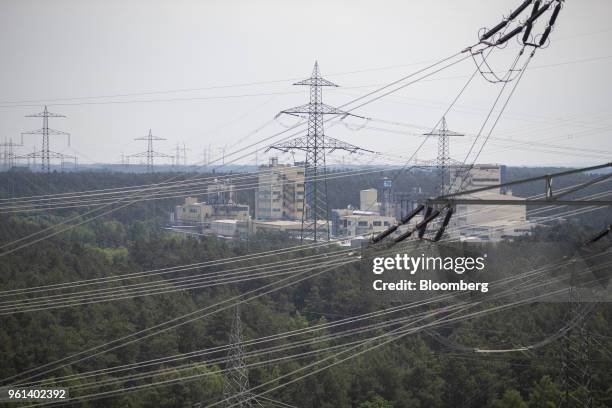 The Baerlocher GmbH chemical factory stands beyond power lines hanging from transmission pylons near the coal powered power plant operated by RWE AG...