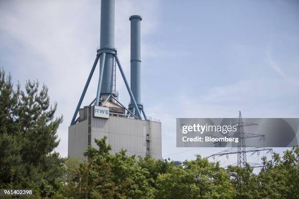 The RWE AG logo sits on a building at the company's gas powered power plant in Lingen, Germany, on Tuesday, May 22, 2018. RWE is transforming to...