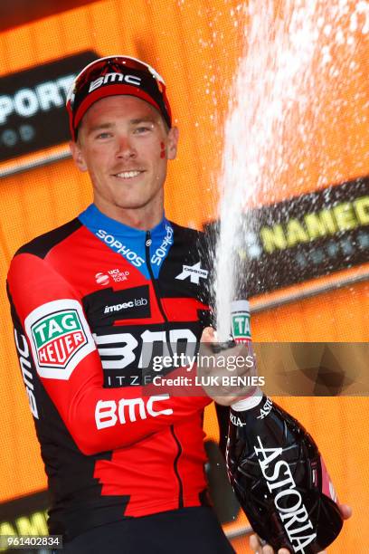 Australia's rider of team BMC Rohan Dennis celebrates on the podium after winning the 16th stage, a time trial between Trento and Rovereto, during...