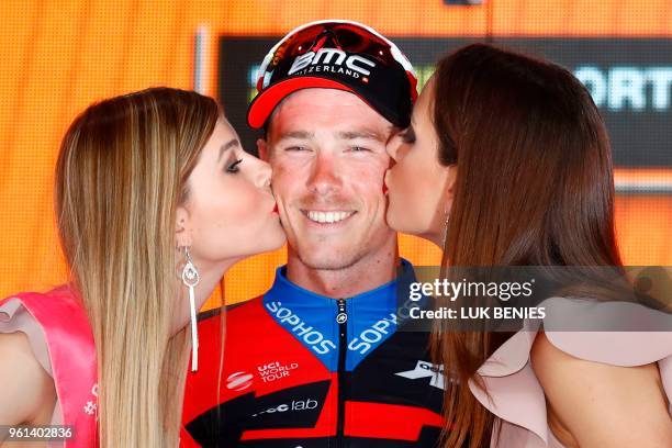 Australia's rider of team BMC Rohan Dennis celebrates on the podium after winning the 16th stage, a time trial between Trento and Rovereto, during...