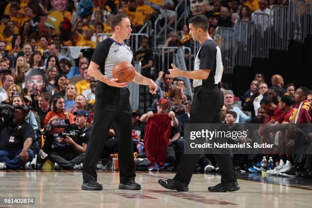 Referees Josh Tiven and Zach Zarba speak in Game Three of the Eastern Conference Finals between the Boston Celtics and the Cleveland Cavaliers during...