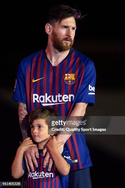 Lionel Messi of FC Barcelona looks on with his son Thiago Messi at the end the La Liga match between Barcelona and Real Sociedad at Camp Nou on May...