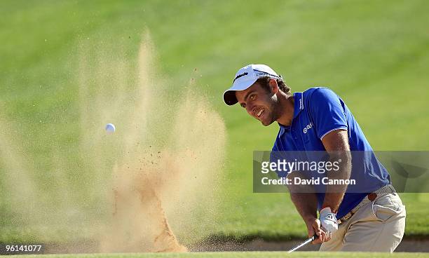 Edoardo Moloinari of Italy plays his third shot at the par 4, 17th hole during the final round of The Abu Dhabi Golf Championship at Abu Dhabi Golf...