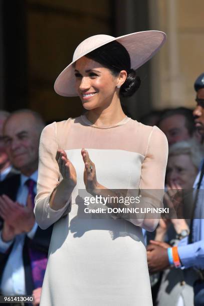 Britain's Meghan, Duchess of Sussex, attends the Prince of Wales's 70th Birthday Garden Party at Buckingham Palace in London on May 22, 2018. - The...