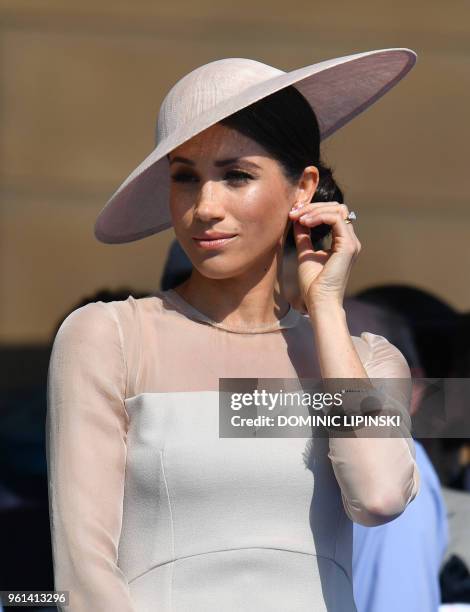 Britain's Meghan, Duchess of Sussex, attends the Prince of Wales's 70th Birthday Garden Party at Buckingham Palace in London on May 22, 2018. - The...