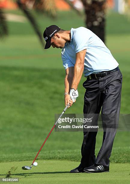 Martin Kaymer of Germany plays his second shot to the par 5, 10th hole during the final round of The Abu Dhabi Golf Championship at Abu Dhabi Golf...