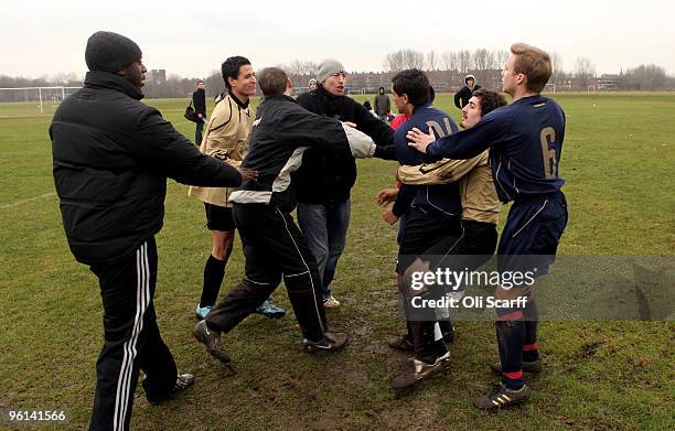 Scuffle breaks out between rival Sunday League teams after a late tackle on the Hackney Marshes pitches on January 24, 2010 in London, England....