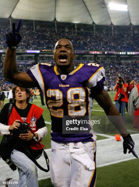 Adrian Peterson of the Minnesota Vikings celebrates their 34-3 victory over the Dallas Cowboys during the NFC Divisional Playoff Game at Hubert H....