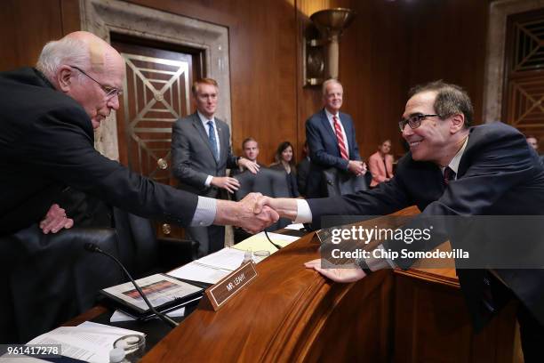 Sen. Patrick Leahy greets U.S. Treasury Secretary Steven Mnuchin before he testifies to the Senate Appropriations Committee's Financial Services and...
