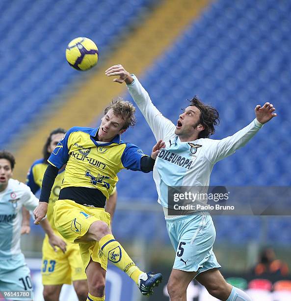 Stefano Mauri of SS Lazio and Luca Rigoni of AC Chievo Verona in action during the Serie A match between Lazio and Chievo at Stadio Olimpico on...