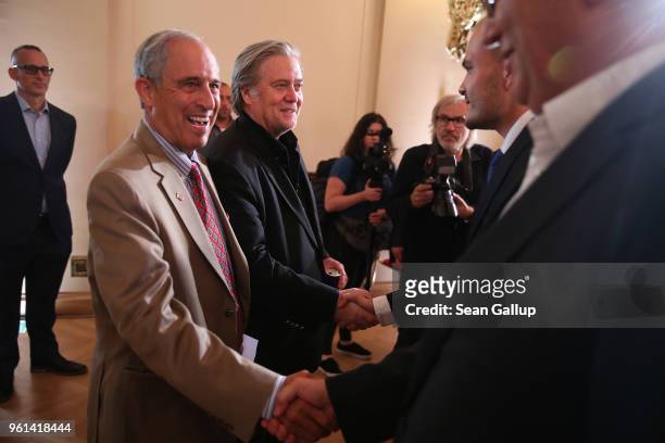 Steve Bannon , former White House Chief Strategist to U.S. President Donald Trump, and Lanny Davis , former special counsel to Bill Clinton, greet...