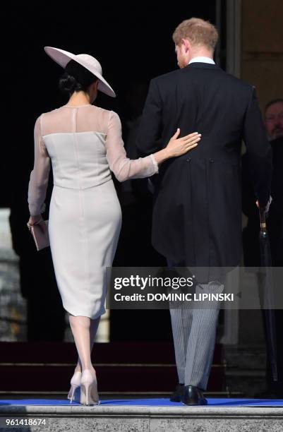 Britain's Prince Harry, Duke of Sussex , and his new wife, Britain's Meghan, Duchess of Sussex, attend the Prince of Wales's 70th Birthday Garden...