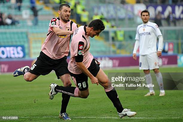 Igor Budan of Palermo celebrates his goal with his team mate Cesare Bovo as Adrian Mutu of Fiorentina looks on during the Serie A match between...